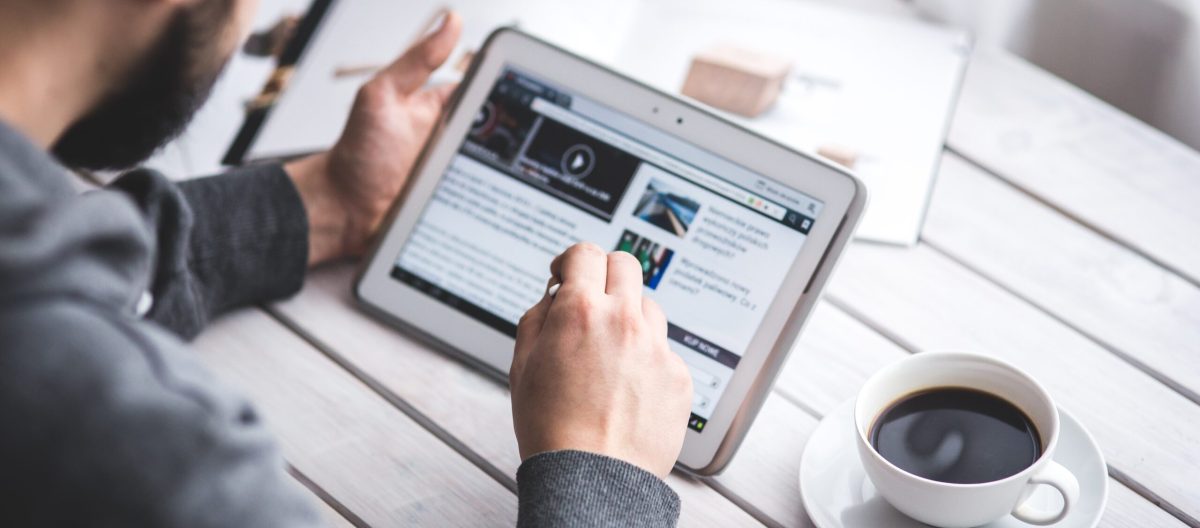 worker-reading-news-with-tablet (1)